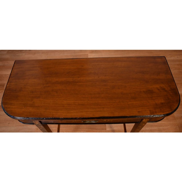 We are pleased to offer this beautiful English Regency console table, from the 1930s. This console is made on Satinwood...