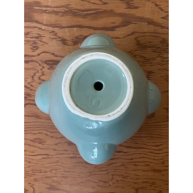 A sweet, rare #10 Mid-Century strawberry planter glazed in a distinct tone of teal with light scalloped relief decorating...