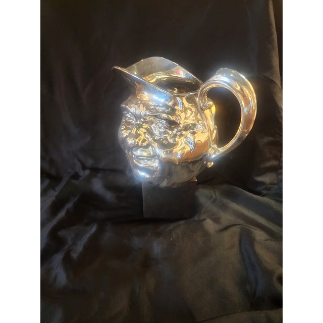 Reed and Barton silverplate Sonny Jim double face pitcher. Marked 5640 and 7HP Reed & Barton on the bottom. Discontinued...