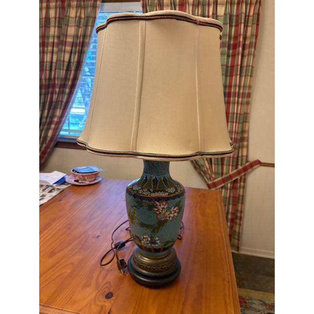 A striking vintage Chinese-export cloisonné enamel table lamp, retaining its original “Made in Hong Kong” label. The vase-...