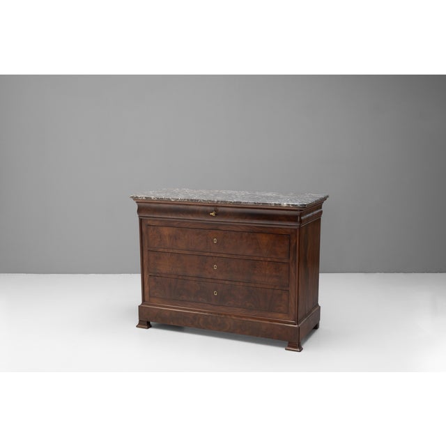 Marble top mahogany commode in the Louis Philipe style. Circa 1880.