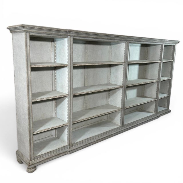 A beautiful and spacious open bookcase in grey. This piece of furniture comes from Sweden in the early 1900s and is...