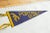 :: Vintage circa 1940s Portage Path School felt flag souvenir banner pennant with imagery of a man carrying a canoe. Blue...
