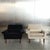 Elegant European lounge chair dating from the early 1960s. The chair features a strong architectural silhouette with broad...