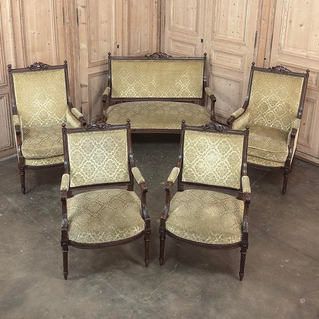 Pair of 19th Century French Louis XVI Walnut Armchairs ~ Fauteuils represents the epitome of the neoclassic style!...