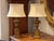 Classic pair of Borghese-style table lamps with carved and gilded urn-form bases. The fluted columns and block plinths...