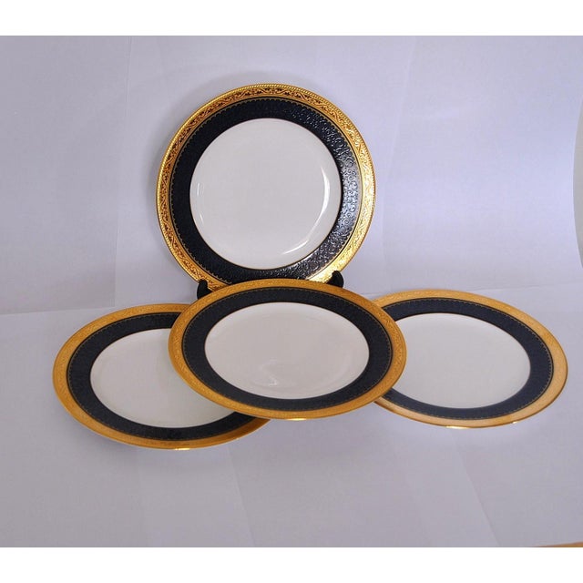 These superb Noritake plates feature a wide, etched gold band, coupled with a wide inner band of delicate soft blue floral...