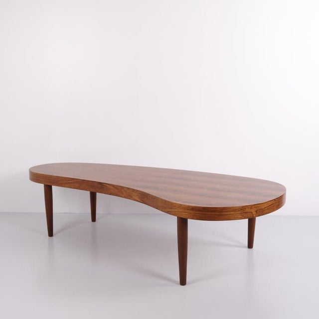 Model pd 81 coffee table designed by axel stensen and produced for povl dinesen in denmark. The table is crafted in...