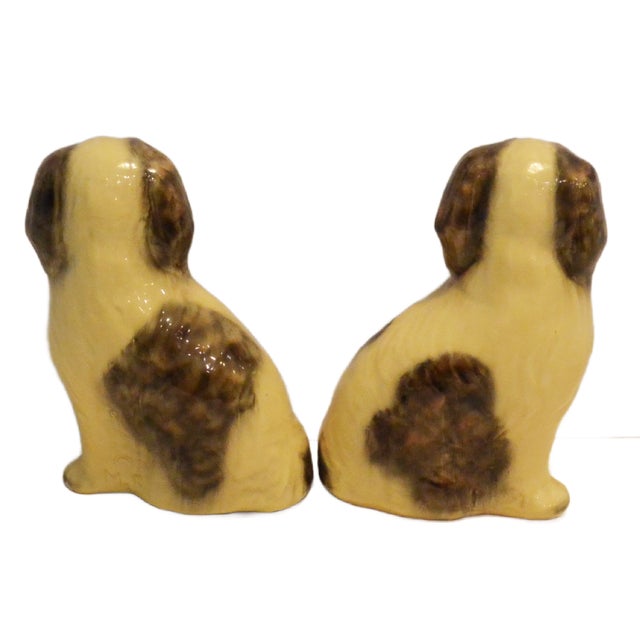 A truly exceptional find for the canine connoisseur: are a matched pair of large Japanese Chin figurines designed by...