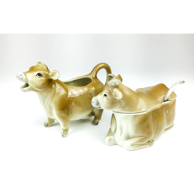 Lovely vintage cow set of creamer and sugar bowl. Circa 1980s porcelain set produced by the Otagiri Mercantile Company...