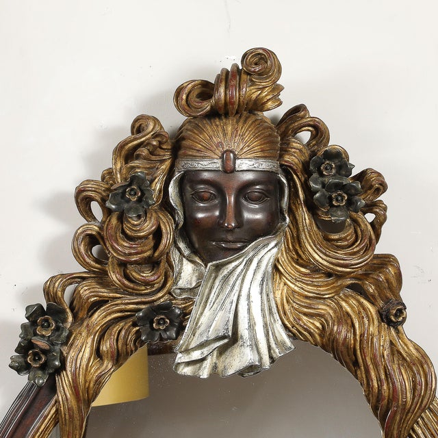 This Art Deco carved sculptural flapper mirror, crafted in Italy circa 1925, is a captivating example of the glamour and...