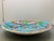 This is a huge hand-painted Kutahya ceramic charger from Turkey. It is signed on the back by the artist Elsam Akdeniz...