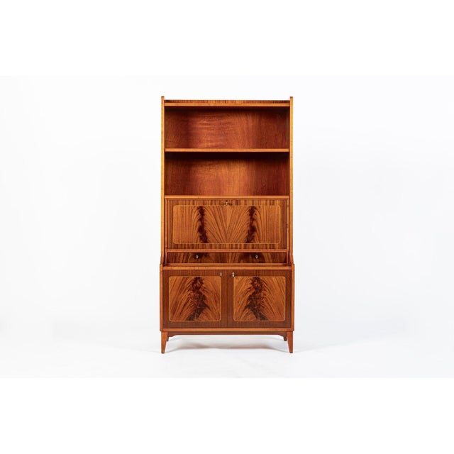 This beautiful vintage mid century Scandinavian modern tall secretary bookshelf cabinet is circa 1960. This one-piece...