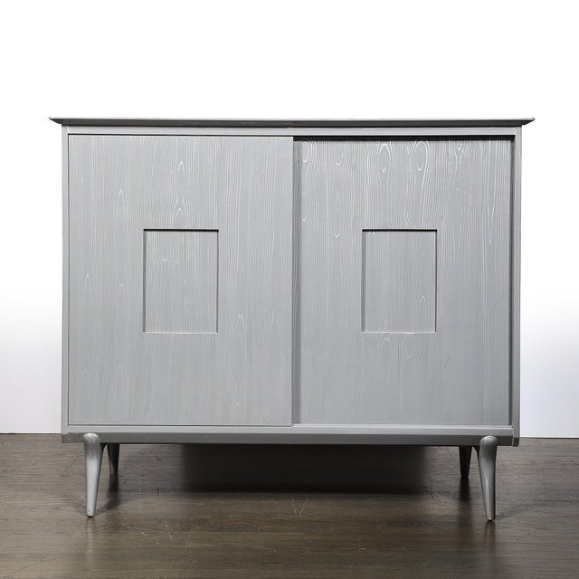 Mid-Century Modern Gentleman’s Chest was realized by the esteemed maker John Stuart Inc. in the United States, circa 1950....