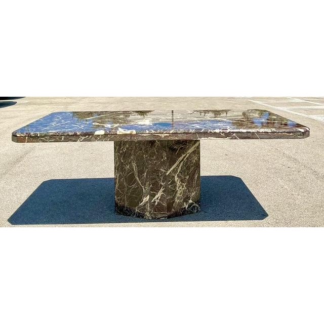 This magnificent 1970s Italian dining table is a bold statement in Rosso Levanto marble, a material prized for its deep...