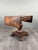 An elegant drop-leaf table in mahogany and mahogany veneer, resting on a central base carved in the shape of a fluted...