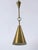Extremely rare, elegant and highly decorative mid-century modern perforated brass pendant lamp or ceiling light. With its...