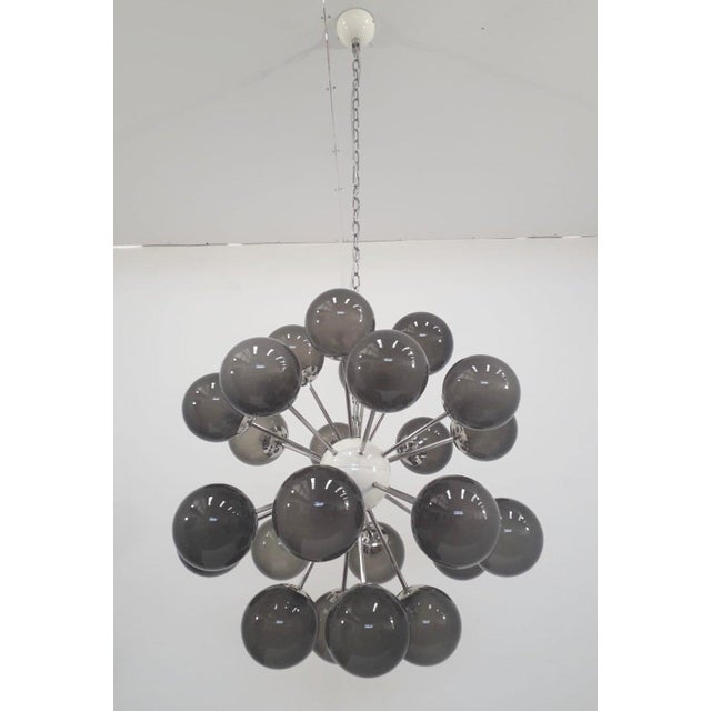 Italian sputnik chandelier with 24 frosted smoky Murano glass globes mounted on polished nickel finish frame / Made in...