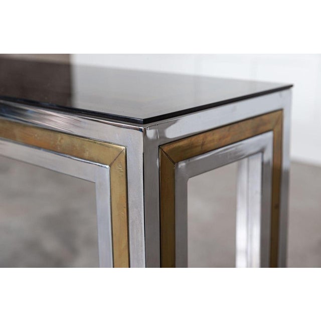 Circa 1970 Italian chrome/brass glass console table. Measures: W91 x D30 x H75 cm.