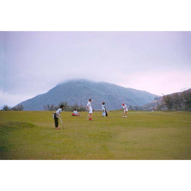 Four by Toni Frissell A group of golfers and caddies prepare for a shot, Hong Kong, 1959. (Photo by Toni Frissell) 16x20"...