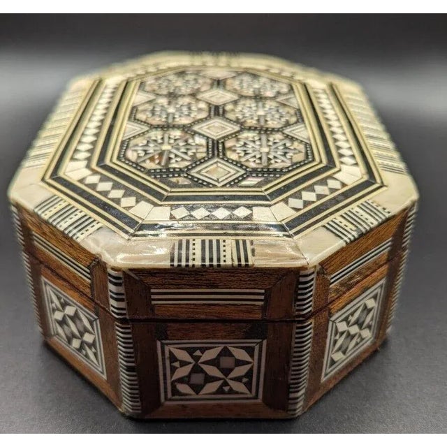 This beautiful handcrafted inlaid mother of pearl box is the perfect accent piece for your home decor. The octagonal shape...