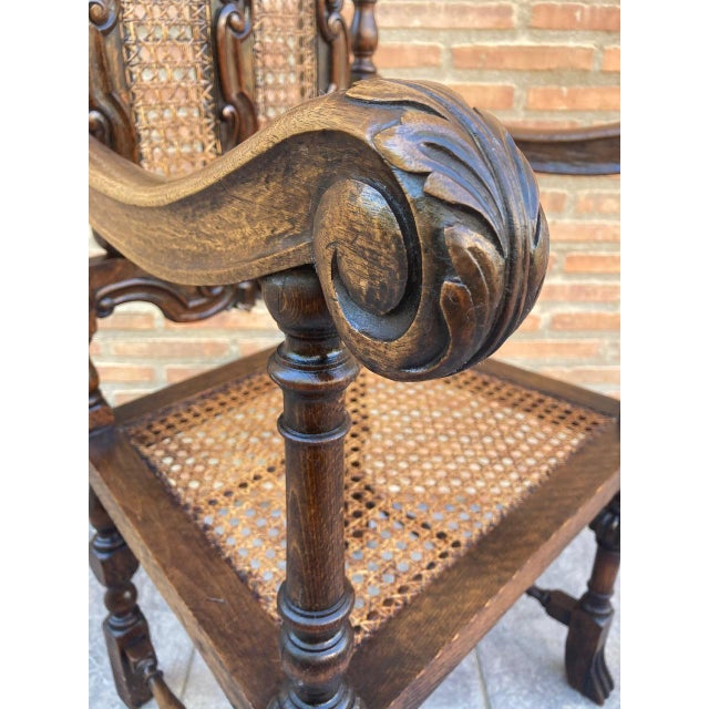 Louis XVI style French carved walnut armchair with reed seats. France, 1920. Solid walnut with original finish. Beautiful...