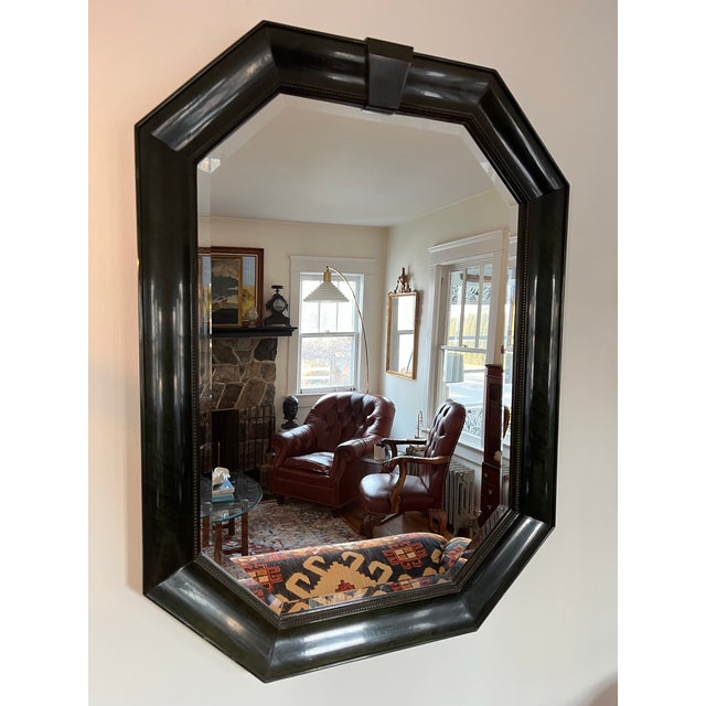 Beautiful octagonal mirror by Bernhardt. Finished in a rich green lacquer. Nicely beveled mirror set in beveled lacquer...