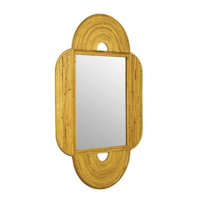 Restored reed rattan arched wall mirror featuring a streamlined 25-strand arch along the top and bottom with 15-strang...