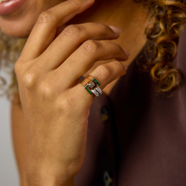 This Retro diamond and emerald ring is a striking reflection of 1940s design, where strength, color, and confident form...
