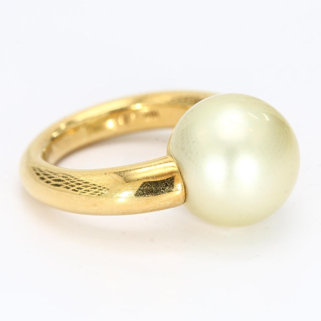 This is a nice, simple, but eye catching ring made of 18k yellow gold and a 13mm round pearl. - Stone Info - Pearl 13mm...