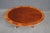 Henkel Harris oval mahogany coffee table featuring a richly figured mahogany top framed by a satinwood-style banded inlay....