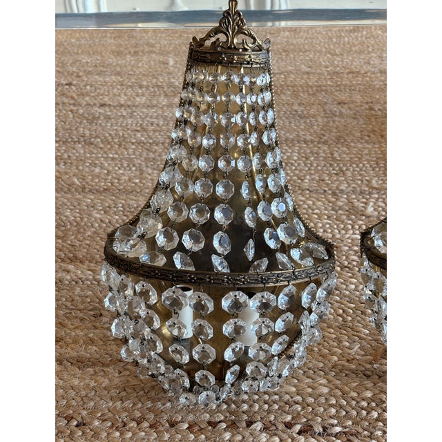 Matching pair of vintage Hollywood Regency / French Empire-style basket wall sconces (often referred to as "sac à perles"...