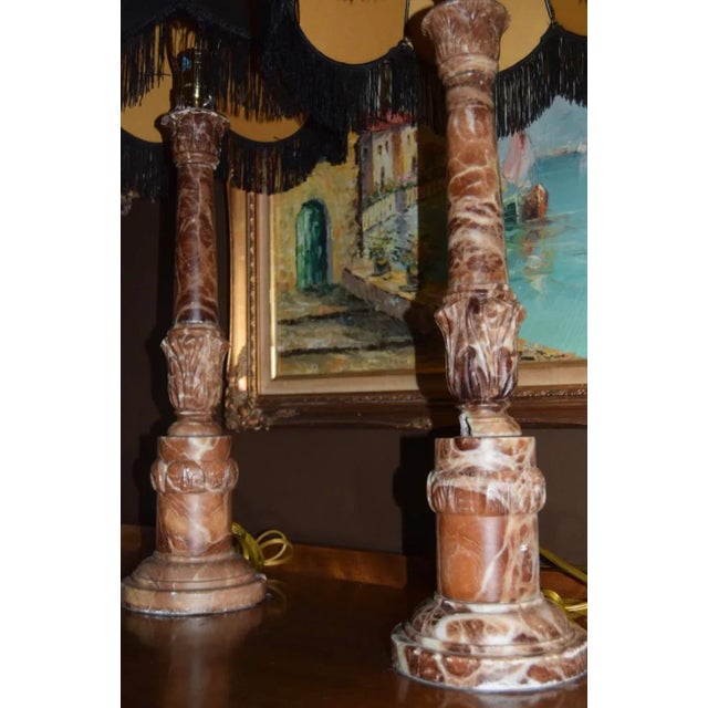 Bold, theatrical, and unapologetically glamorous—this pair of carved red marble column lamps brings serious presence to a...