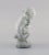 This is a decorative stone figure from Kähler, Denmark. The figure in glazed stoneware of Leda and the swan. It is made...