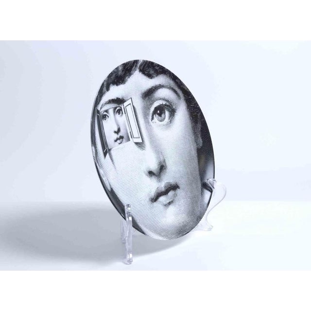 Iconic ceramic plate with black and white screen print on the surface, depiting Lina Cavalieri (Fornasetti's Muse),...