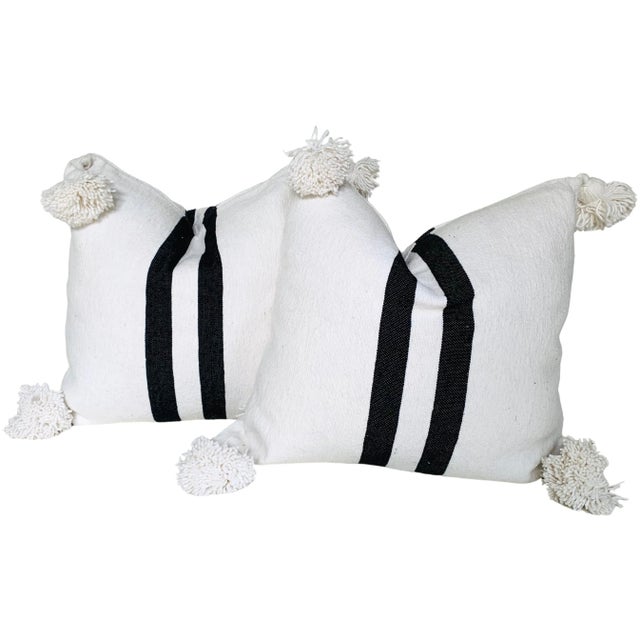 Pair of Moroccan handloomed cotton pom pom pillows with zipper closure New duck feather-and-down fill inserts. Pattern on...