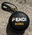 This Vintage Fendi Fila Mania Bag Charm features the iconic Fendi and Fila collaboration logo, typically rendered in bold,...