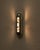 00 wall sconce by pietro franceschini materials: cast aluminium or cast bronze dimensions: w 10 x d 15 x h 50 cm all our...