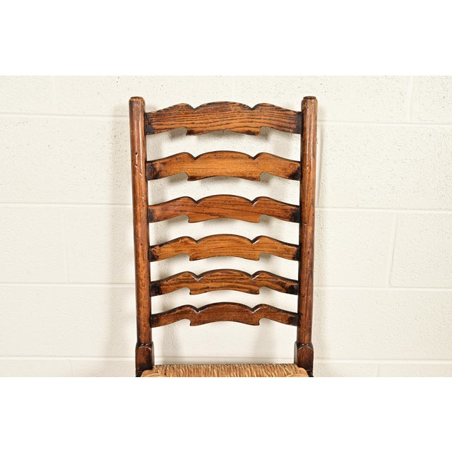 Baker Furniture Style English Country Rustic Carved Solid Oak Ladder Back Dining Chairs With Rush Seats, Pair For Sale In South Bend - Image 6 of 13