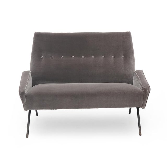 2-seater sofa of Italian manufacture produced in the 1950s based on a design by Felice Rossi. Legs in black painted metal....