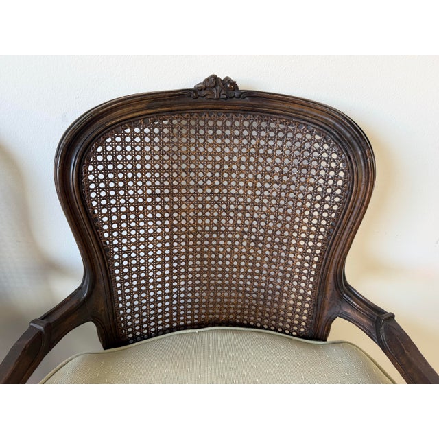 Vintage French Louis XV Style Carved Walnut & Cane Back Arm Accent Chairs – A Pair For Sale - Image 11 of 12
