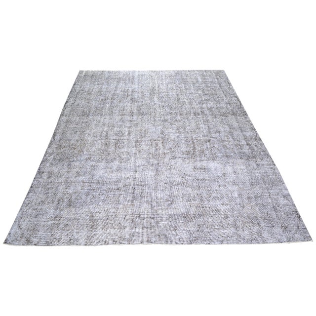 Hand-knotted with care using traditional rug making techniques, this wool rug blends timeless craftsmanship with a modern...