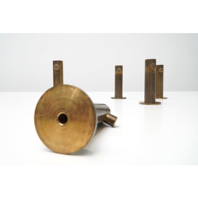 A set of five wall hooks in polished bronze by Belgian designer Antoine Callebaut. Each piece is crafted in a precise...