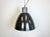 This grey Industrial pendant light was designed in the 1960s and produced by Elektrosvit in former Czechoslovakia. It...