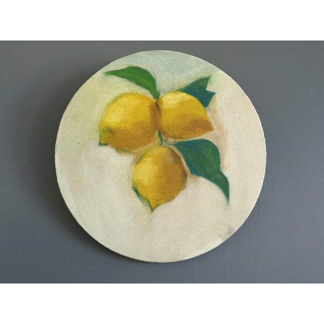 LEMONS Size: 7.9 x 7.9 inches Oil on Canvas board A contemporary oil painting on a round canvas board featuring three...