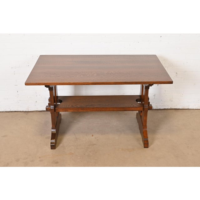 A rare and exceptional antique Mission oak Arts & Crafts trestle library table or writing desk By Gustav Stickley USA,...