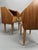 Enhance your bedroom with this exceptional pair of authentic 1950s Italian nightstands featuring rich teak veneering and...