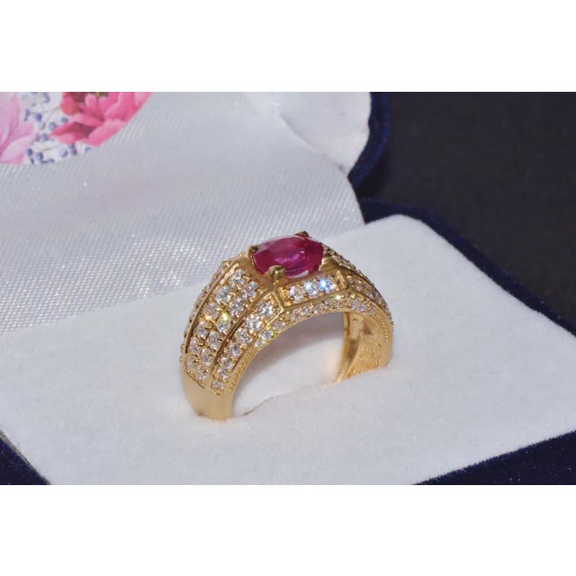 Gorgeous 18K solid gold 2.81CTS diamond and ruby cigar ring. This ring features a gorgeous wide band design with diamonds...