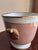 Fitz & Floyd cachepot from the Versailles Shell Peach collection, produced between 1984 and 1992. White glazed body with...