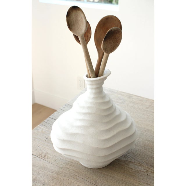 Unique contemporary ceramic utensil holder with organic dimensional wavy pattern. Rustic wooden spoons included. Shipping:...